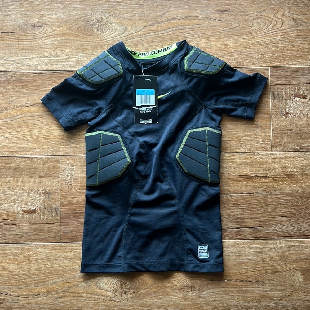 NWT Boys Nike compression shirt with pads.  Size Med.
